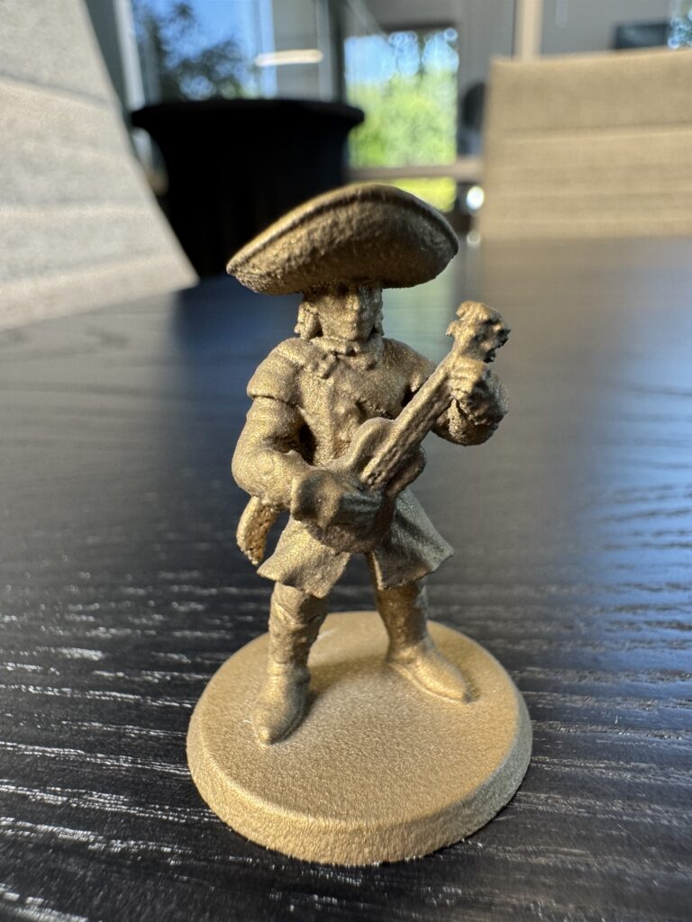 The finished gold Cerakote miniature — front view.